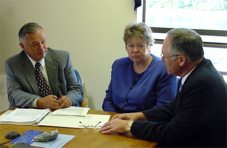 Greg O'Claray, Gale Sinnott and Dr Roy Gizzard seated at a table
